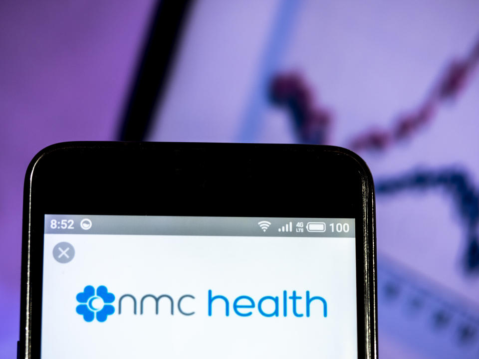 UKRAINE - 2019/03/16:  In this photo illustration, the NMC Health PLC logo seen displayed on a smartphone. (Photo Illustration by Igor Golovniov/SOPA Images/LightRocket via Getty Images)