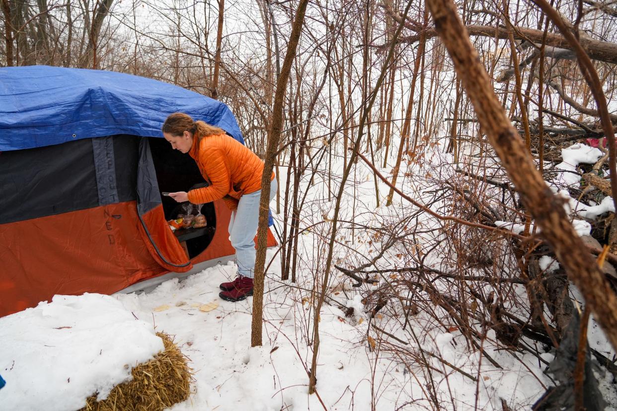 Des Moines homeless policy administrator Amber Lewis reads a survey to a woman as part of a January count of homelessness in Des Moines.