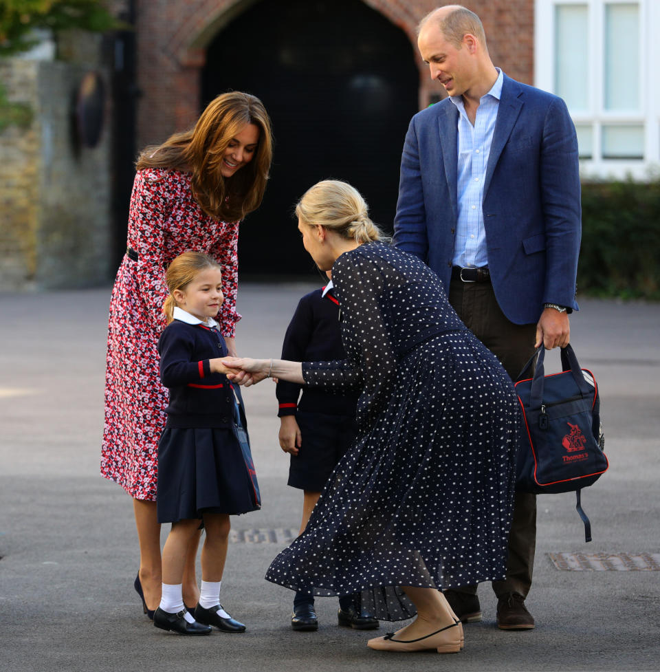 LONDON, UNITED KINGDOM - SEPTEMBER 5: Helen Haslem, head of the lower school greets Princess Charlotte as she arrives for her first day of school, with her brother Prince George (hidden) and her parents the Duke and Duchess of Cambridge, at Thomas's Battersea in London on September 5, 2019 in London, England. (Photo by Aaron Chown - WPA Pool/Getty Images)