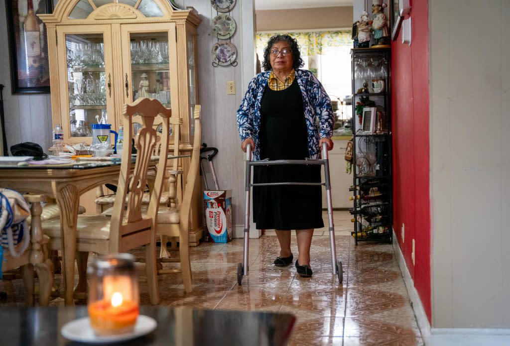 At the Kansas City Chiefs Super Bowl parade, Sarai Holguin heard what she thought were fireworks, unaware she had been shot. Holguin underwent surgery and doctors opted to leave the bullet in her leg. She’s now using a walker to get around. (Christopher Smith for KFF Health News)