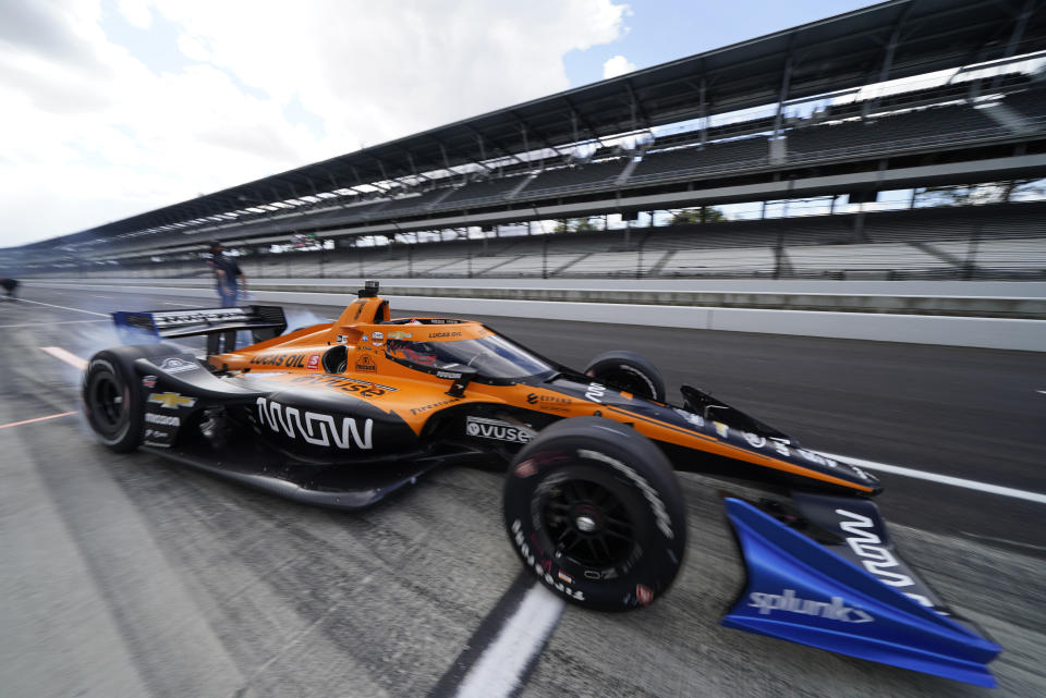 Helio Castroneves, of Brazil, pulls out of the pits during a practice session for an IndyCar auto race at Indianapolis Motor Speedway, Thursday, Oct. 1, 2020, in Indianapolis. (AP Photo/Darron Cummings)