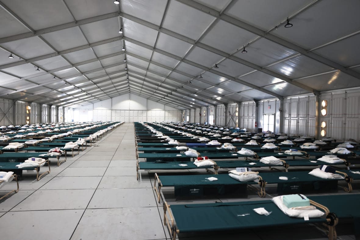 NEW YORK, NEW YORK – OCTOBER 18: Beds are seen in the dormitory during a tour of the Randall’s Island Humanitarian Emergency Response and Relief Center on October 18, 2022 in New York City. The construction of the relief centers began after NYC Mayor Eric Adams, who declared a state of emergency due to continued arrivals of migrants, announced their relocation to Randall’s Island from Orchard Beach in the Bronx after concerns about flooding. The tent-like structures will provide temporary housing to 500 asylum seekers that are being bused into the city by the Republican governors from border states. (Photo by Michael M. Santiago/Getty Images)