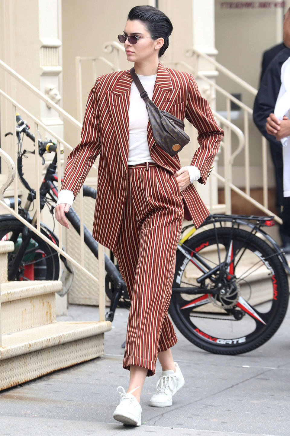 <p><strong><strong>5 June</strong></strong> Kendall Jenner wore her favourite vintage Louis Vuitton <a rel="nofollow noopener" href="http://www.harpersbazaar.co.uk/fashion/shows-trends/news/g37890/good-taste-bad-taste-fashion-trend/" target="_blank" data-ylk="slk:bumbag;elm:context_link;itc:0;sec:content-canvas" class="link ">bumbag</a><span> across her pinstripe </span>Wolk Morais suit with her hair slicked back while in New York.</p>