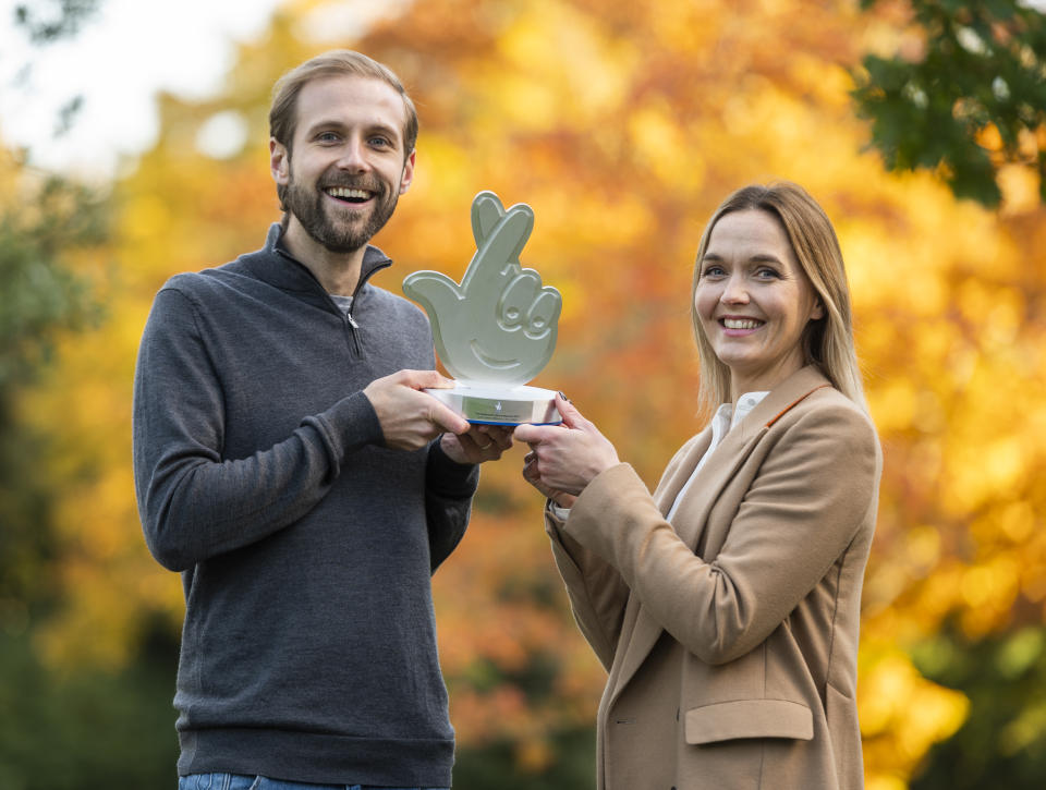 Former Olympic champion Victoria Pendleton presenting Chris Sellar with his National Lottery Award