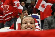 A Canadian fan watches during play between Canada and the Czech Republic during the first period of their IIHF World Junior Championship ice hockey game in Malmo, Sweden, December 28, 2013. REUTERS/Alexander Demianchuk (SWEDEN - Tags: SPORT ICE HOCKEY)
