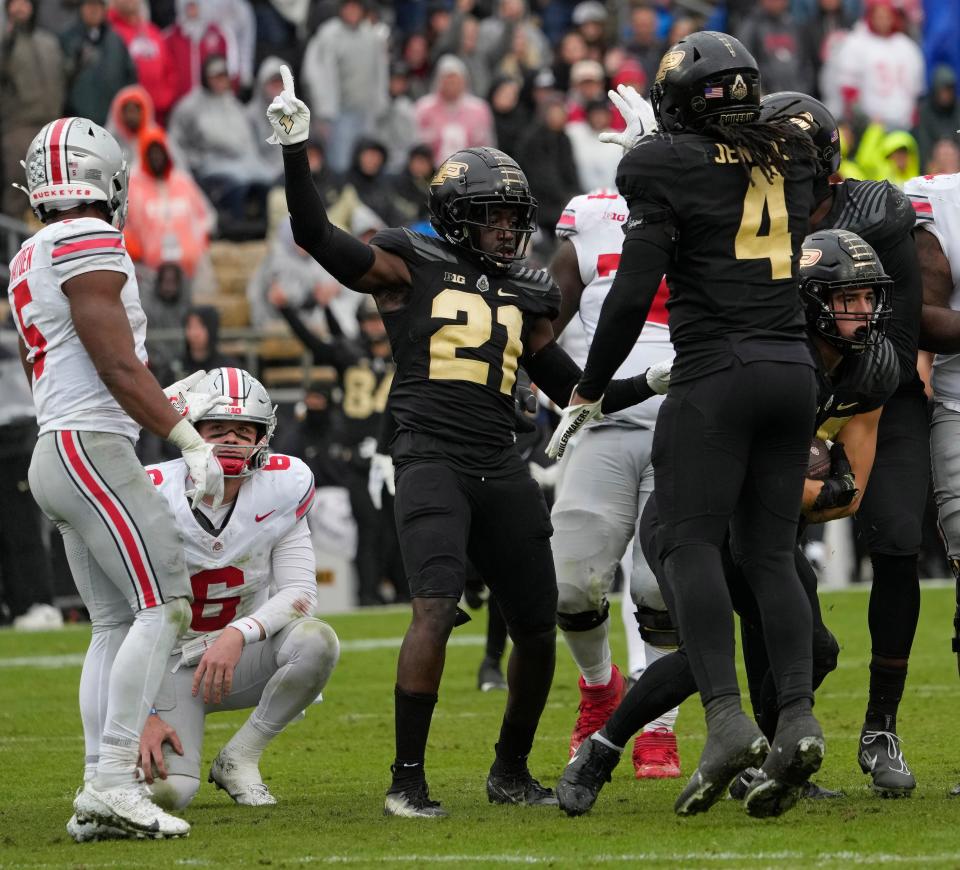 Oct. 14, 2023; Lafayette, In., USA; 
Purdue Boilermakers linebacker Yanni Karlaftis (14) comes up with the football after a fumble by Ohio State Buckeyes quarterback Kyle McCord (6) during the second half of Saturday's NCAA Division I football game at Ross-Ade Stadium in Lafayette.