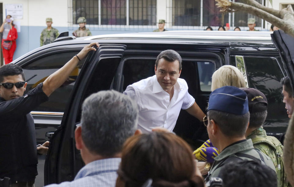 President Daniel Noboa arrives to vote in a referendum to endorse new security measures to crackdown on criminal gangs responsible for increasing violence, in Olon, Ecuador, Sunday, April 21, 2024. (AP Photo/Cesar Munoz)