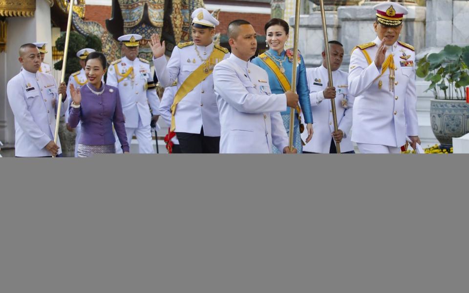 King Maha Vajiralongkorn, pictured greeting supporters on Wednesday, holds great constitutional power in Thailand - EPA