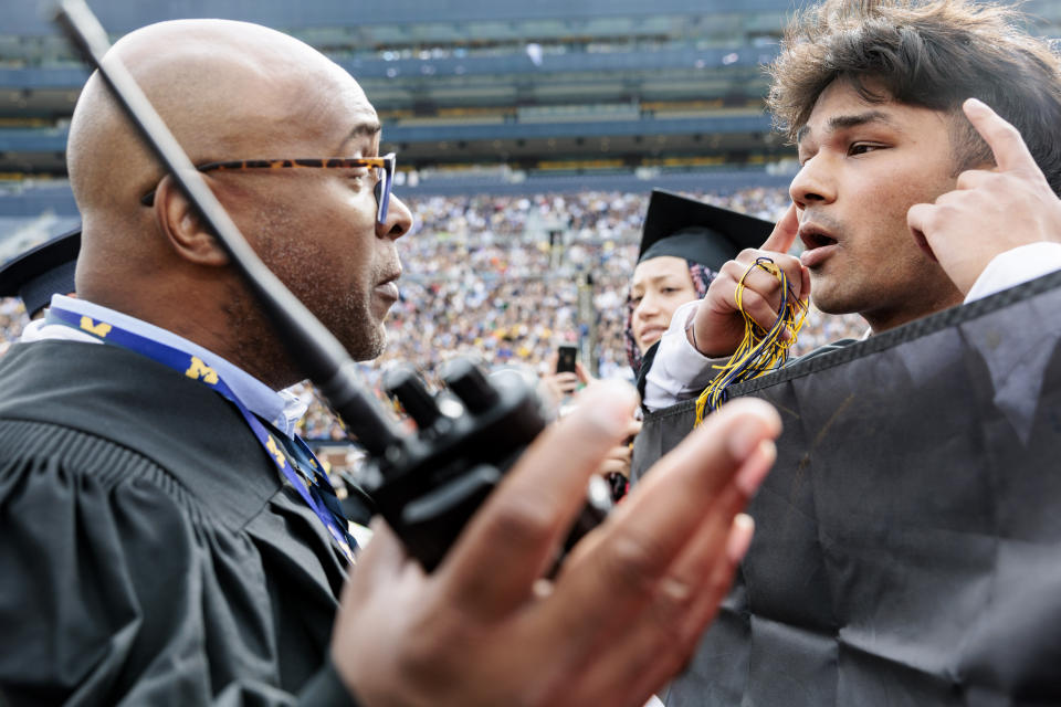 Pro-Palestinian protesters demonstrate during the University of Michigan's Spring 2024 Commencement Ceremony at Michigan Stadium in Ann Arbor, Mich., on Saturday, May 4, 2024.( Jacob Hamilton/Ann Arbor News via AP)