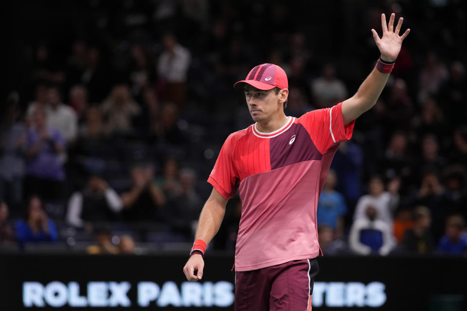 Alex de Minaur waves to the crowd.