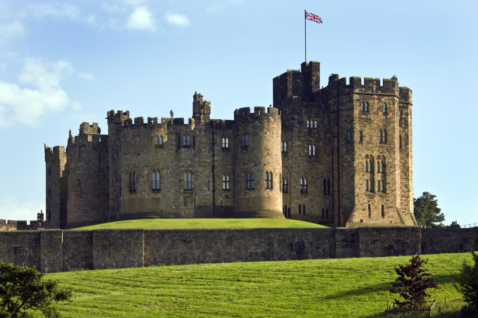 Alnwick, United Kingdom - July 29, 2008: Alnwick Castle in the town of Alnwick in Northumberland in North East England. Dates from 1096AD when Yves de Vescy became Baron of Alnwick and erected the earliest parts of the castle. Since 1309 the castle has been in the hands of the Percy Family who are the Dukes and Earls of Northumberland.