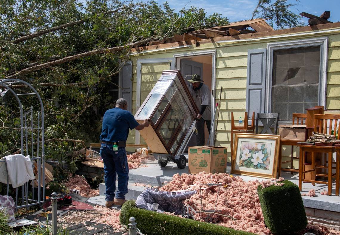 Family members help clean up the home of Evelyn Powell, an Edgecombe County Commissioner, Thursday, July 20, 2023 in Battleboro. An EF3, tornado with wind speeds of 150 mph touched down in Nash and Edgecombe Counties around 12:30 p.m. Wednesday according to the Raleigh National Weather Service. Travis Long/tlong@newsobserver.com