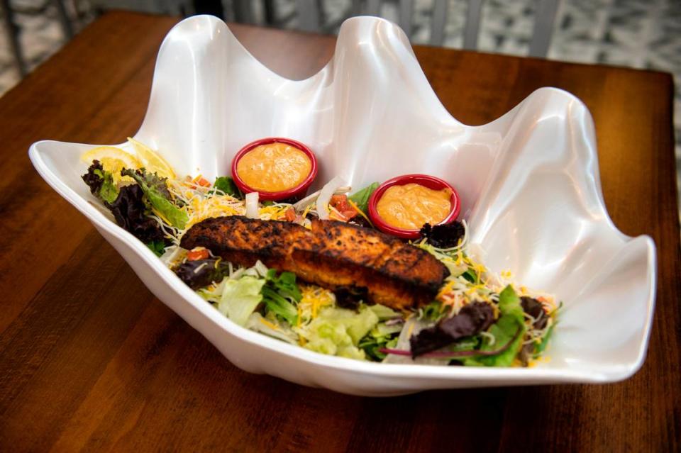 The Char-grilled salmon salad from Port 17 at Harrah’s in Biloxi on Thursday, July 20, 2023. Hannah Ruhoff/Sun Herald