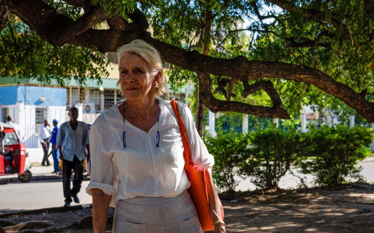 Hilary Monson looks at one of the police officers accused accused in the involvement of her son's death outside the Mombasa High Court in Kenya on October 23, 2019. - Katie G. Nelson 