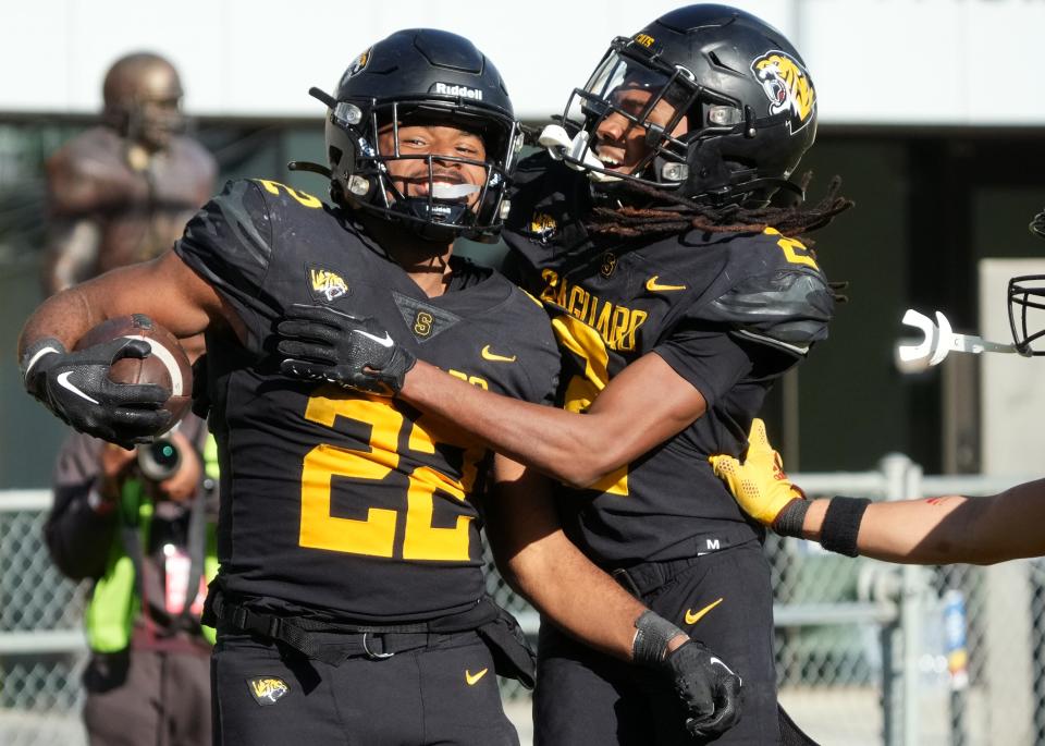 Saguaro running back Jacob Brown (22) celebrates his touchdown run with teammate Jaci Dickerson (2) during their 6A State Championship game against Red Mountain at Mountain America Stadium in Tempe on Dec. 2, 2023.