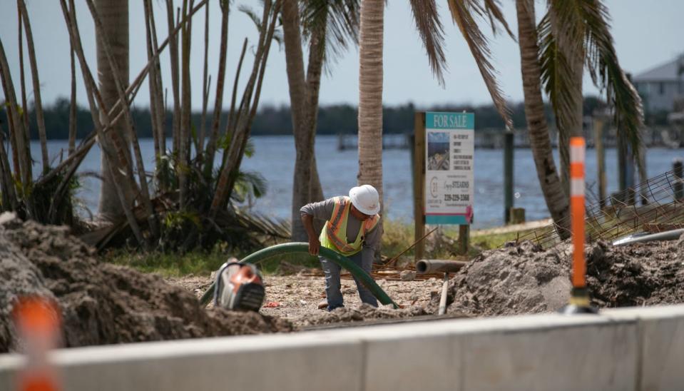 Construction workers continue to make progress along Pine Island Road in Matlacha as they prepare the road and clear out debris in the area. Almost a year after Hurricane Ian impacted the area, some businesses are still in the process of recovery.