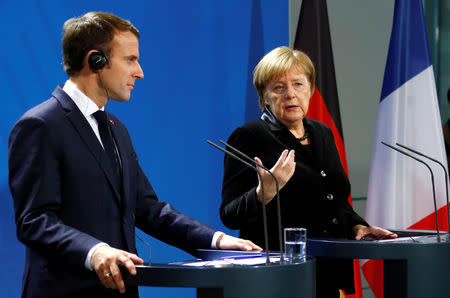 French President Emmanuel Macron and German Chancellor Angela Merkel speak to reporters ahead of their meeting in Berlin, Germany, November 18, 2018. REUTERS/Fabrizio Bensch