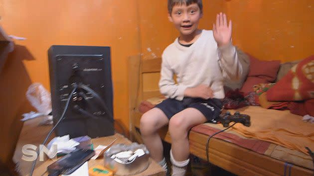 A boy plays in his 'apartment'