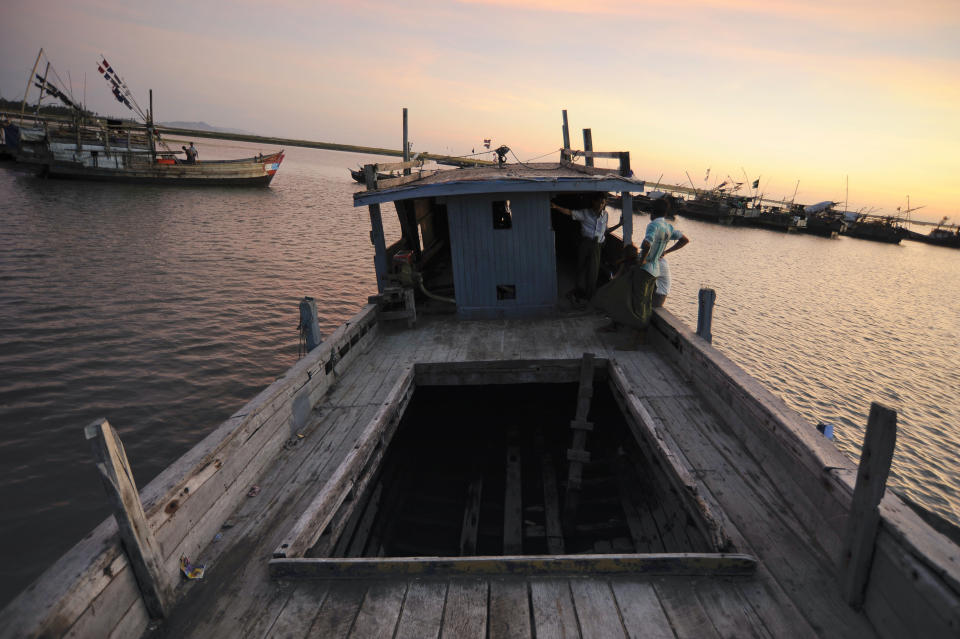 In this Nov. 28, 2013 photo, a boat which was intended to carry fleeing Rohingya Muslims until doubts arose about its seaworthiness, is docked at a lagoon near the The' Chaung refugee camp on the outskirts of Sittwe, Myanmar. Although the United Nations considers the Rohingya to be among the most persecuted groups on earth, nearby countries easily reachable by boat have been implementing policies and practices to ensure that Rohingya refugees don't wash up on their shores. (AP Photo/Kaung Htet)