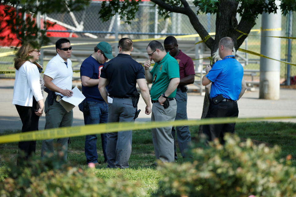 Police investigate the shooting scene.&nbsp;