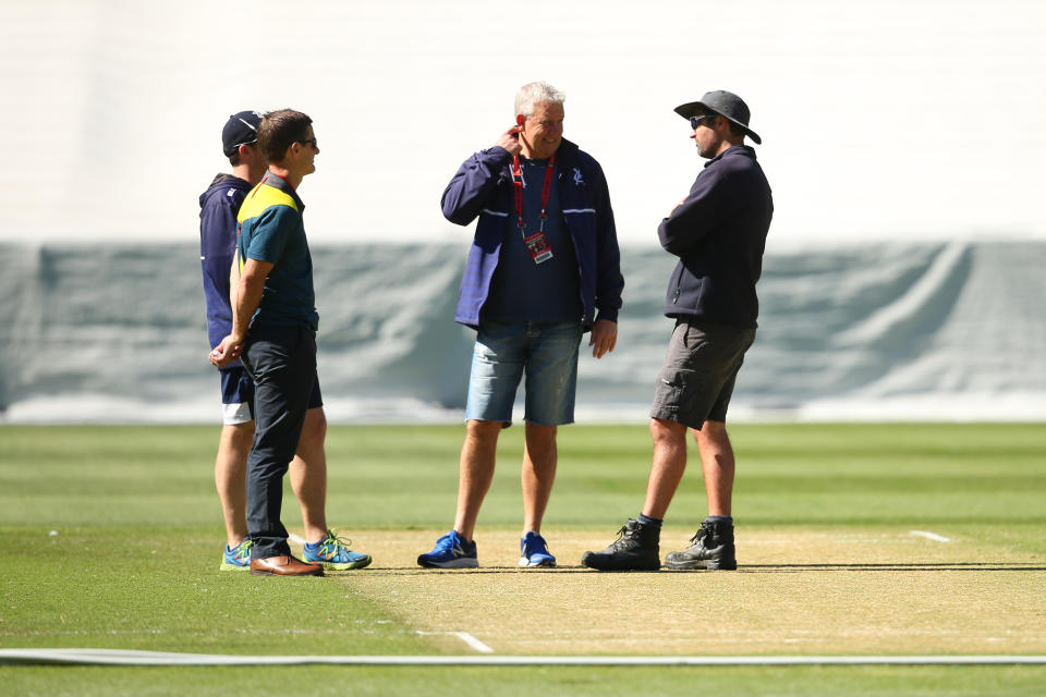 Officials are seen speaking with the curator, as play is abandoned due to an unsafe pitch prior to the start of day two of the Sheffield Shield match between Victoria and Western Australia at Melbourne Cricket Ground on December 08, 2019 in Melbourne, Australia.