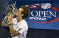 Andy Murray of Great Britain kisses the US Open trophy after his win over Novak Djokovic of Serbia in their men's singles final at the 2012 US Open tennis tournament September 10, 2012 in New York. Murray defeated Djokovic 7-6 (12/10), 7-5, 2-6, 3-6, 6-2 in an epic US Open final