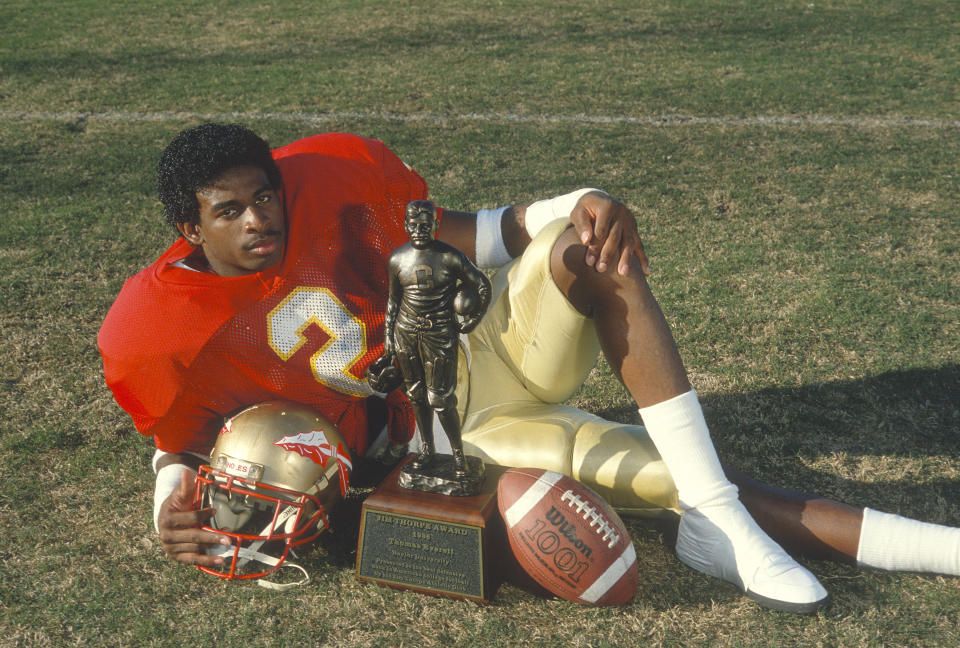 Defensive back Deion Sanders of the Florida State Seminoles poses with his 1988 Jim Thorpe Award trophy in Tallahassee. (Photo: Focus On Sport via Getty Images)