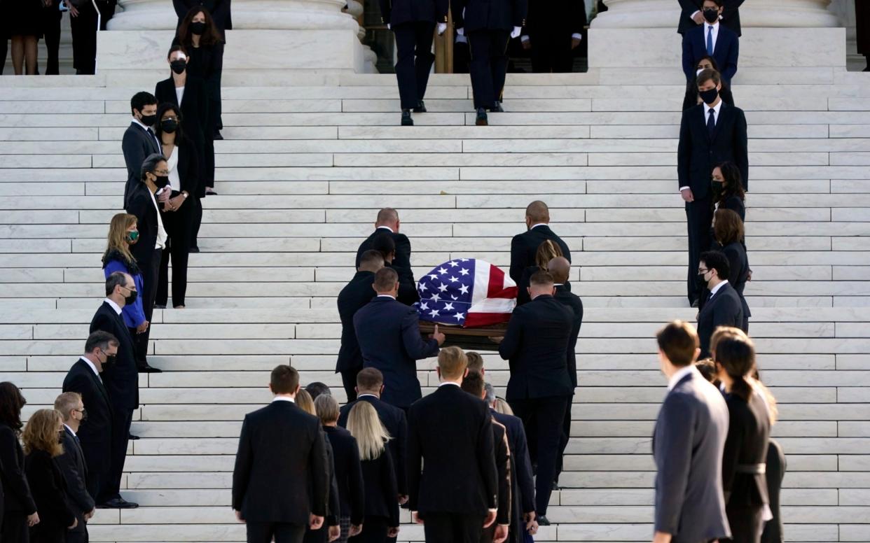 The flag-draped casket of Justice Ruth Bader Ginsburg arrives at the Supreme Court in Washington on Wednesday - AP Photo/J. Scott Applewhite