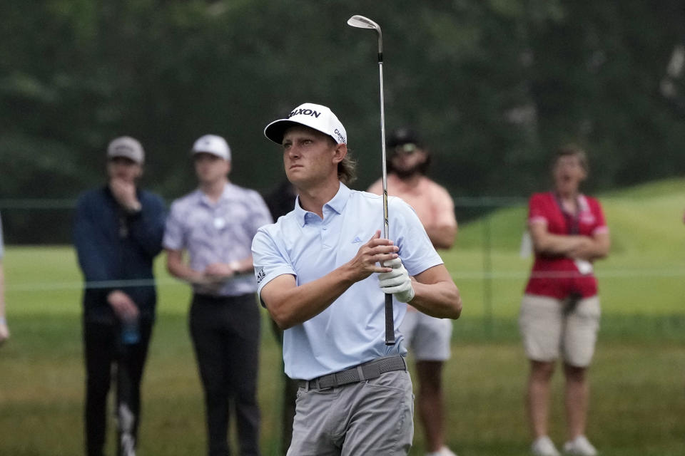 Peter Kuest hits his approach shot onto the first green during the final round of the Rocket Mortgage Classic golf tournament at Detroit Country Club, Sunday, July 2, 2023, in Detroit. (AP Photo/Carlos Osorio)