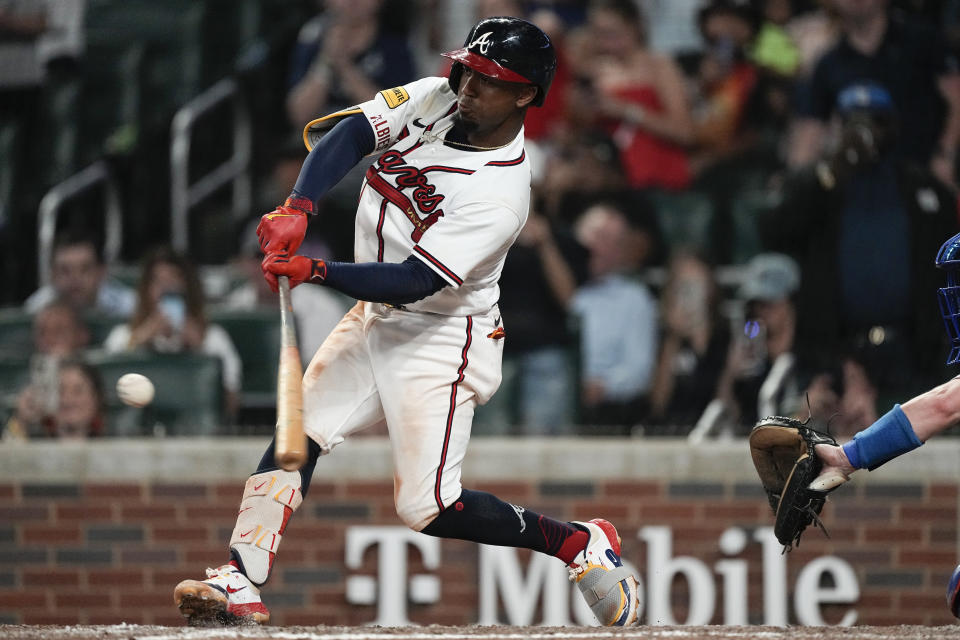 Atlanta Braves' Ozzie Albies drives in the winning run with a sacrifice fly against the Los Angeles Dodgers during the ninth inning of a baseball game Wednesday, May 24, 2023, in Atlanta. (AP Photo/John Bazemore)