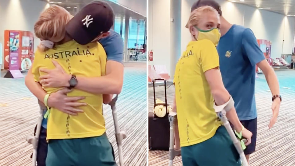Australian Olympian Genevieve Gregson embraces her husband after they were reunited at Singapore Airport.