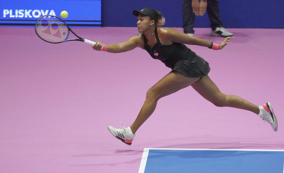 Naomi Osaka, of Japan returns a shot against Karolina Pliskova, of Czech Republic during the final match of the Pan Pacific Open women's tennis tournament in Tokyo Sunday, Sept. 23, 2018. (AP Photo/Eugene Hoshiko)