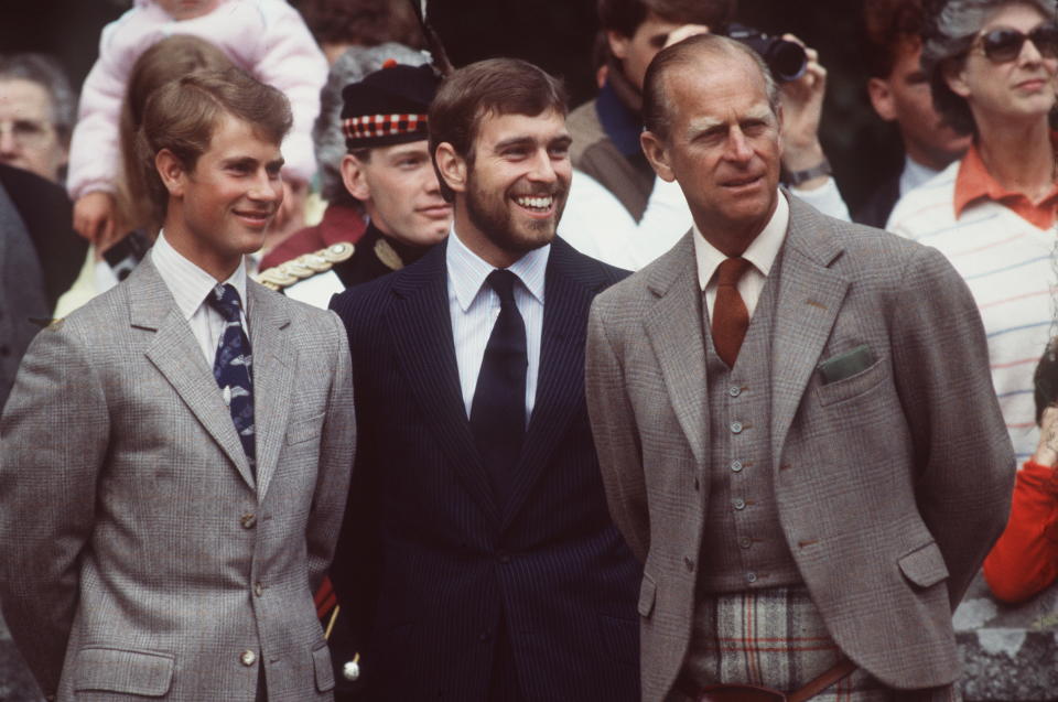 Prince Andrew stands between Prince Edward and Prince Philip in 1983. (Getty Images)