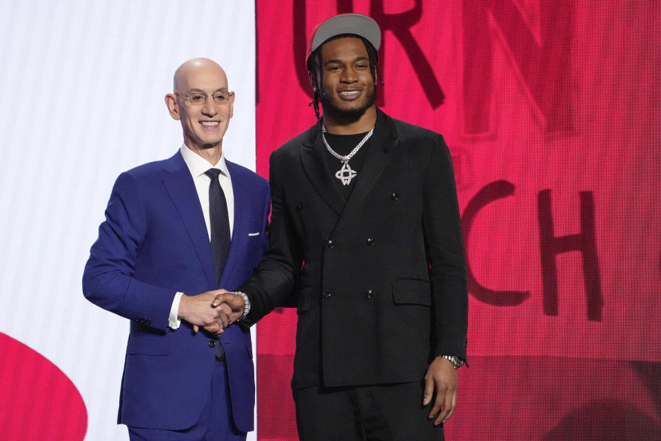 Cam Whitmore poses for a photo with NBA Commissioner Adam Silver after being selected 20th overall by the Houston Rockets during the NBA basketball draft, Thursday, June 22, 2023, in New York. (AP Photo/John Minchillo)