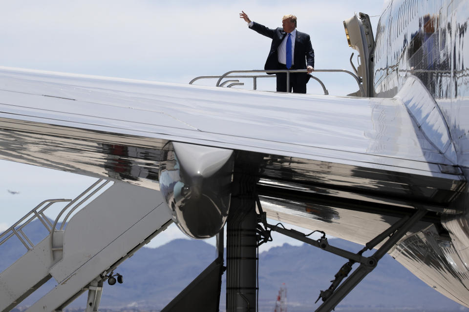 President Donald Trump waves from the top of the stairs of Air Force One as he leaves Las Vegas after speaking at the Republican Jewish Coalition's annual leadership meeting, Saturday April 6, 2019, en route to Washington. (AP Photo/Jacquelyn Martin)