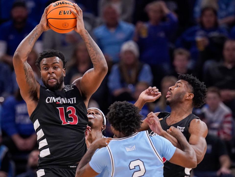 Bearcats forward Jamille Reynolds looks for a teammate after grabbing a rebound in Tuesday night's NIT quarterfinal loss to top-seeded Indiana State 85-81.