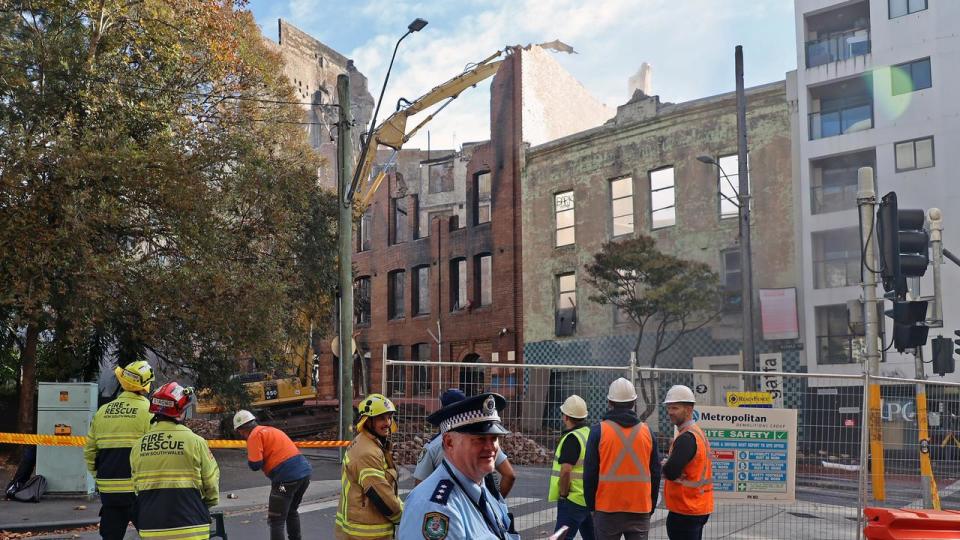 SYDNEY, AUSTRALIA - NewsWire Photos - MAY 30, 2023: The controlled demolition of a building in Sydney's Surry Hills gets underway after the site was destroyed in a massive blaze last week.  Picture: NCA NewsWire / Nicholas Eagar