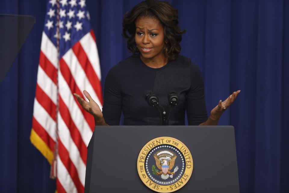 First lady Michelle Obama speaks about college education, Thursday, Jan. 16, 2014, in the Eisenhower Executive Office Building on the White House complex in Washington. The event which is to promote opportunities for students to attend and finish college and university, was attended by college and university presidents and leaders from nonprofits, foundations, governments and businesses. (AP Photo/Charles Dharapak)