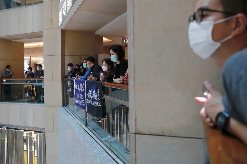 Pro-democracy demonstrators stage a rally at a shopping mall in Hong Kong