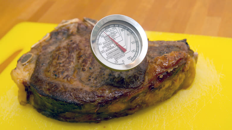Steak resting with meat thermometer