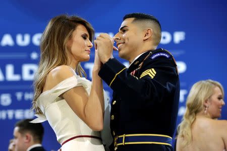 U.S. first lady Melania Trump dances with army services member at the Armed Services Ball in Washington, U.S., January 20, 2017. REUTERS/Yuri Gripas