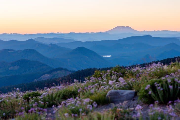 <span class="article__caption">A view of Mount St. Helens from Mount Hood</span> (Photo: Josh Boes/Getty)