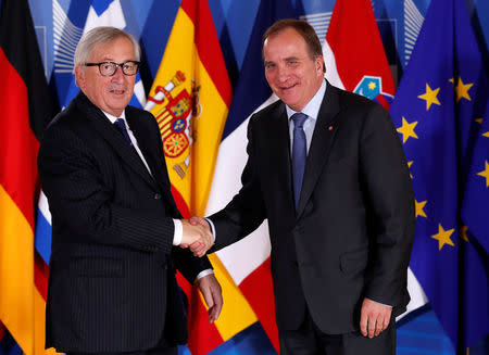 Swedish Prime Minister Stefan Lofven is welcomed by European Commission President Jean-Claude Juncker at the start of an emergency European Union leaders summit on immigration at the EU Commission headquarters in Brussels, Belgium June 24, 2018. REUTERS/Yves Herman/Pool