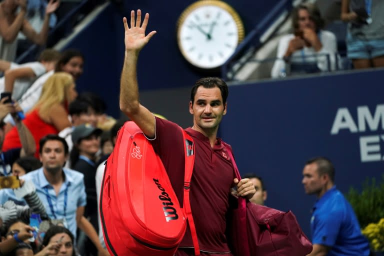 It's all over: Roger Federer waves as he walks off court after losing to Australia's John Millman in the fourth round