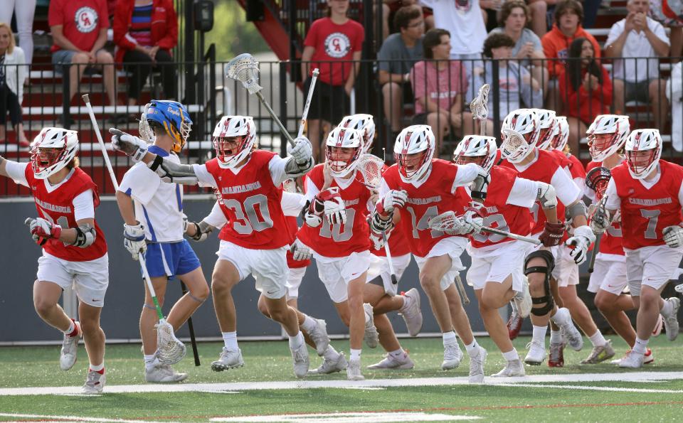 The Canandaigua bench celebrates the team's 7-3 win over Irondequoit for the Class B title.