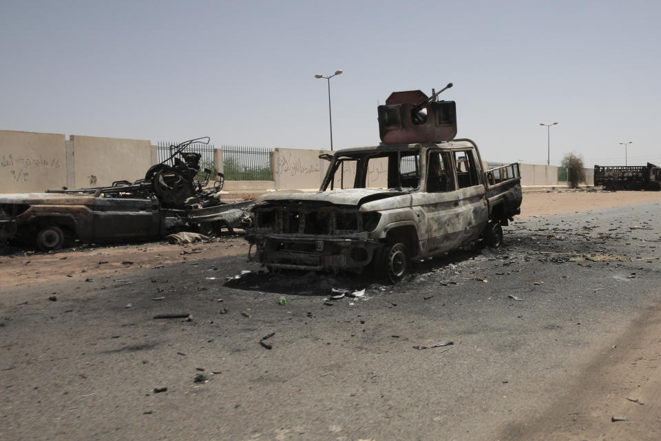 Destroyed military vehicles are seen in southern in Khartoum, Sudan, Thursday, April 20, 2023. The latest attempt at a cease-fire between the rival Sudanese forces faltered as gunfire rattled the capital of Khartoum. Through the night and into Thursday morning, gunfire could be heard almost constantly across Khartoum. (AP Photo/Marwan Ali)