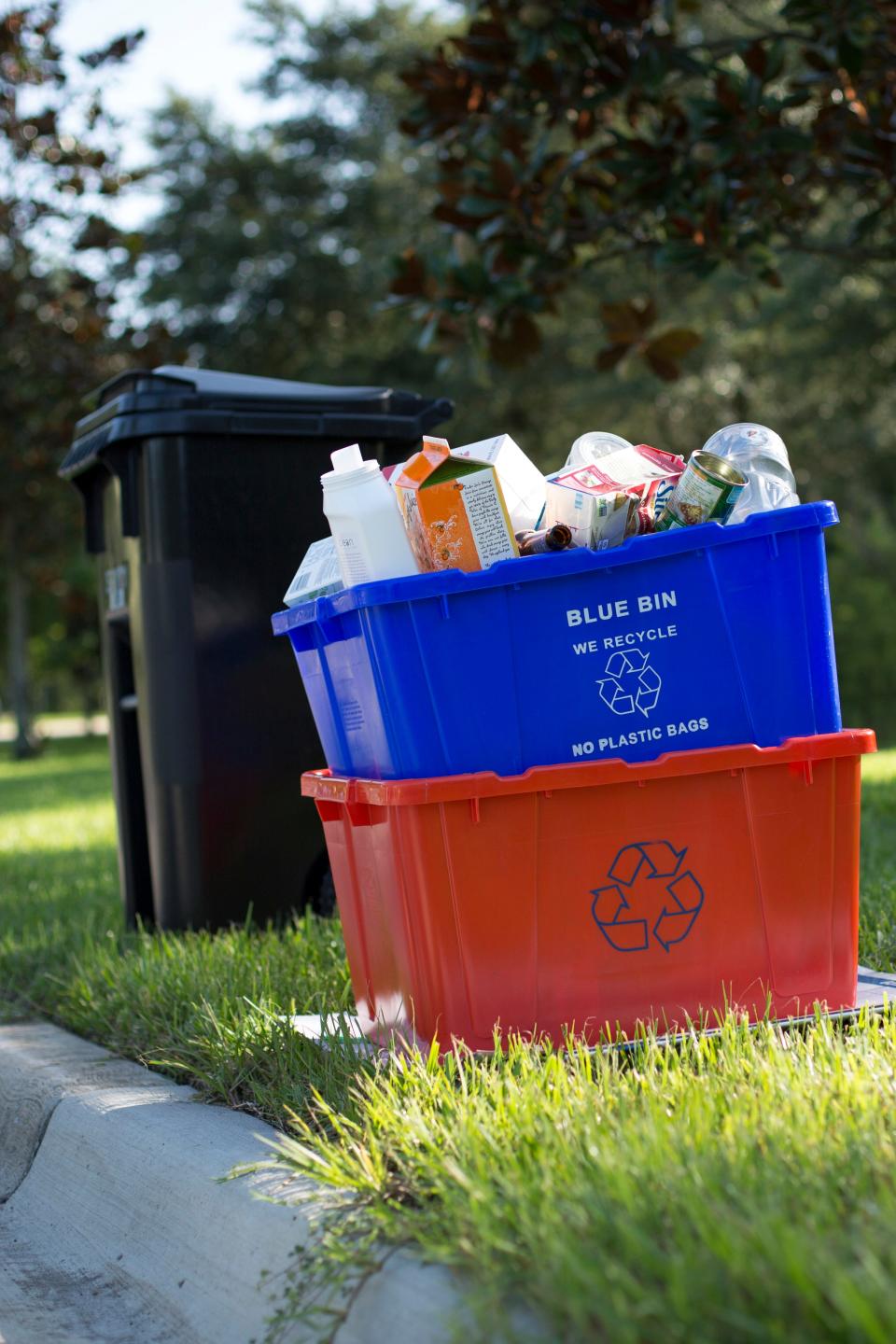 Blue and orange recycling bins