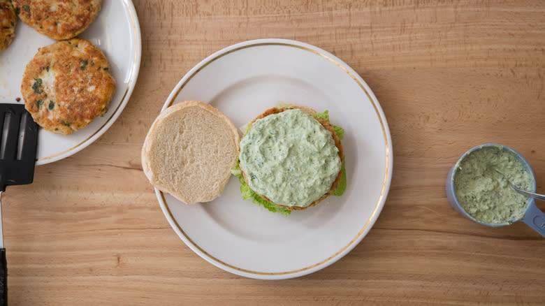 open burger with green sauce 
