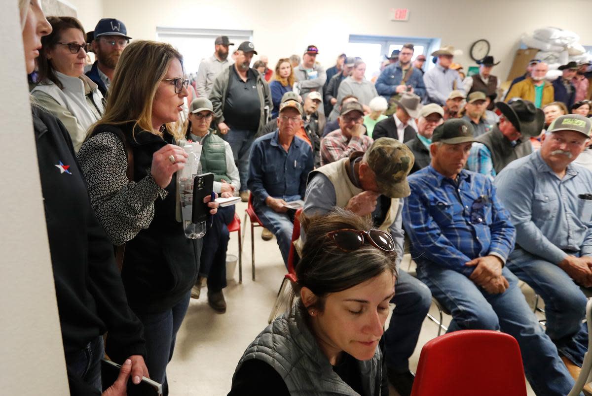 Christy Oats, left, talks to the farmers and ranchers attending a USDA informational meeting at the Hemphill County Exhibition center in Canadian on March 5, 2024.