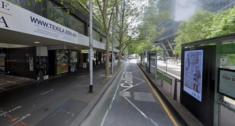 Collins Street narrow lane behind a tram stop.